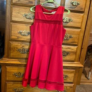 Red, knee or just below the knee dress. Like- new condition. Very flattering.